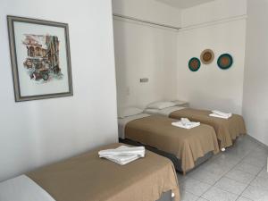Postel nebo postele na pokoji v ubytování Louiza Hotel