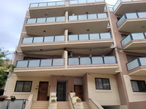 a building with balconies on the side of it at Large Apartment in Marsascala. sleeps 6 in Marsaskala