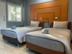พบรักรีสอร์ท Pobruk resort客房内的一张或多张床位