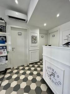 a kitchen with a counter and a checkered floor at Domus Giordano in Rome