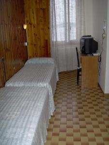 Postel nebo postele na pokoji v ubytování Lago Maggiore