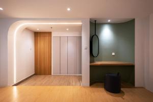 a room with a hallway with a closet and a door at The Bayou Hotel Langkawi in Pantai Cenang