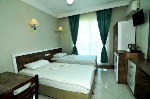 A bed or beds in a room at Cleopatra King Apart Még 37 kép