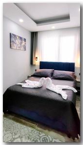 Postel nebo postele na pokoji v ubytování Aspendos Suites Konyaaltı Apart