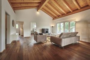 a living room with two couches and a table at Terrace Vista Interlaken in Interlaken