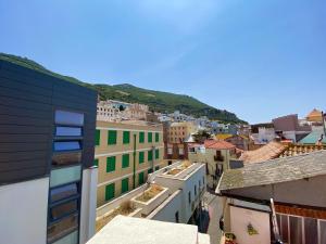 an aerial view of a city with buildings at Deluxe City Centre Two Bedroom with Private Balcony - Grand Central House in Gibraltar