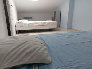 Posteľ alebo postele v izbe v ubytovaní Maison des Pins