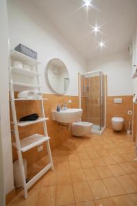 a bathroom with a ladder and a sink and a mirror at APPARTAMENTI MUSEO 3 in Verona +12 photos