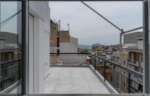 a balcony with a view of a city at Maxblue 2 in Piraeus