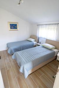 A bed or beds in a room at Oasis apartment Sabunike