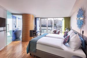 Ліжко або ліжка в номері Sedartis Swiss Quality Hotel