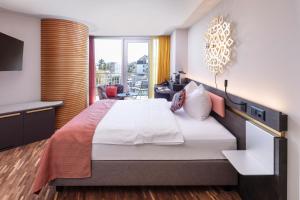 Ліжко або ліжка в номері Sedartis Swiss Quality Hotel