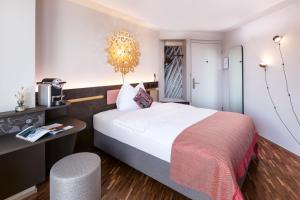 Ліжко або ліжка в номері Sedartis Swiss Quality Hotel