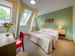 Postel nebo postele na pokoji v ubytování Hotel Michael