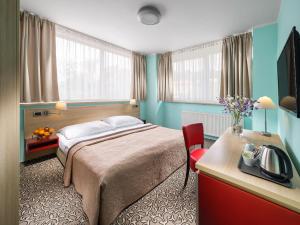 Postel nebo postele na pokoji v ubytování Hotel Michael