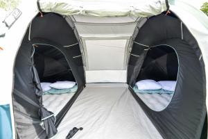 an open tent with two beds in it at KempingZator Namioty in Zator +152 photos