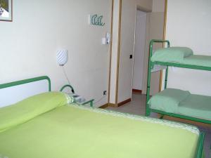Postel nebo postele na pokoji v ubytování Lago Maggiore