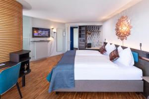 Ліжко або ліжка в номері Sedartis Swiss Quality Hotel