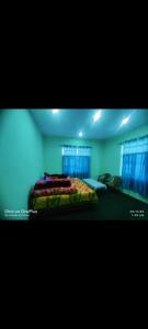a bedroom with a bed in a room at Zangmo Home Stay Nako in Nako