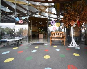 a building with a floor with polka dots and a tree at Paragon Hotel and Suites in Baguio