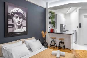 A bed or beds in a room at Luxury Studio Apartment in the Heart of Athens