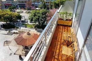 an overhead view of a balcony of a building at high end suite at the center of Heraklion in Heraklio