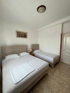 a bedroom with two beds in a room at Imperator Apartments in Ulcinj