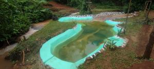 an overhead view of a swimming pool at a resort at LUSHOTO EXECUTIVE LODGE in Lushoto
