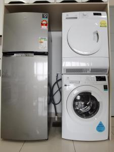 a washing machine and a refrigerator in a room at ●T11●2Pax●Studio●5min●Queensbay●Pg Bridge View● in Bayan Lepas
