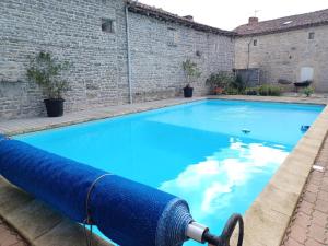 The swimming pool at or close to Wisteria Cottage at Gites de la Vienne