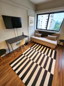 TV a/nebo společenská místnost v ubytování Flat Exclusivo no Itaim Bibi