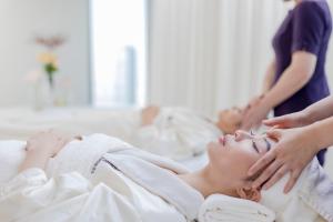 a woman getting a massage at a spa at The Ritz-Carlton Shanghai, Pudong in Shanghai