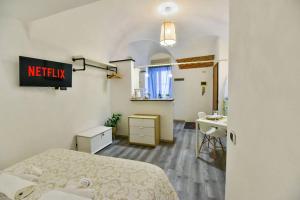 a hotel room with a bed and a bathroom at Welcome Varigotti - Borgo Saraceno - Tramontana in Varigotti