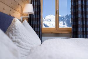 Postel nebo postele na pokoji v ubytování 3100 Kulmhotel Gornergrat