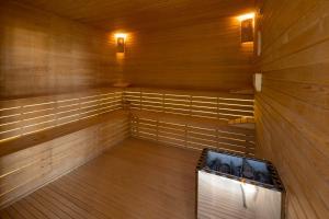 an empty sauna with wood paneling and lights at Aldiana Club Zanzibar Kwanza in Kizimkazi