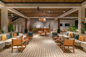 a lobby at the resort with couches and tables at Aldiana Club Zanzibar Kwanza in Kizimkazi
