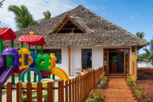 a small house with a playground in front of it at Aldiana Club Zanzibar Kwanza in Kizimkazi