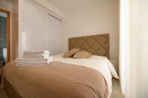 מיטה או מיטות בחדר ב-PIMENTA FOUR HOUSE