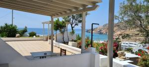 a house with a view of the ocean at Avgerinou Studios in Paliochori