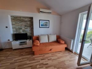 TV a/nebo společenská místnost v ubytování Apartments Katarina