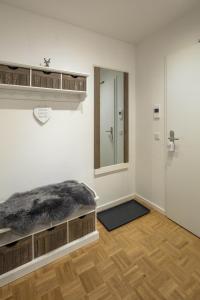 a room with a bed and a mirror on the wall at Acapella Suite Barcarolle 60qm, direkt am Weinberg, Altstadt, Netflix inklusive in Heppenheim an der Bergstrasse