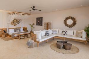 a living room with a couch and a bed at Aldiana Club Zanzibar Kwanza in Kizimkazi