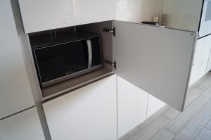 Kuchyň nebo kuchyňský kout v ubytování Charme Lake Loft