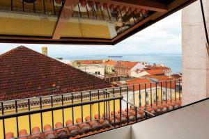 a view of a train station from a balcony at My Chiado Suite in Lisbon