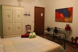a bedroom with a bed with red shoes on it at Casa Vacanze TwentyMiles in Castellana Sicula