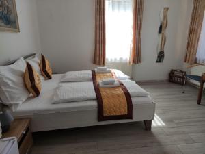 Letto o letti in una camera di Pension VIDHOUS 1