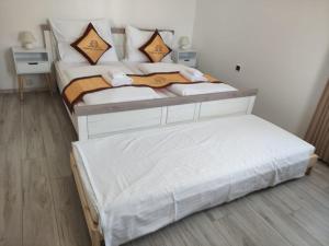 Letto o letti in una camera di Pension VIDHOUS 1