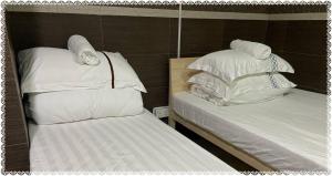 Postel nebo postele na pokoji v ubytování 安捷賓館 Famous Guest House