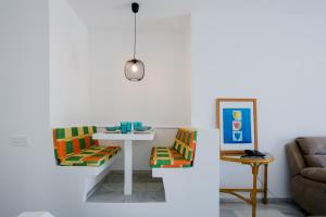 a living room with a table and a couch at Estudio Altamira 128 - Tenerife in Adeje