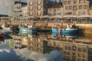 a group of boats are docked in a harbor at Ocean City Apartment-with parking in Plymouth